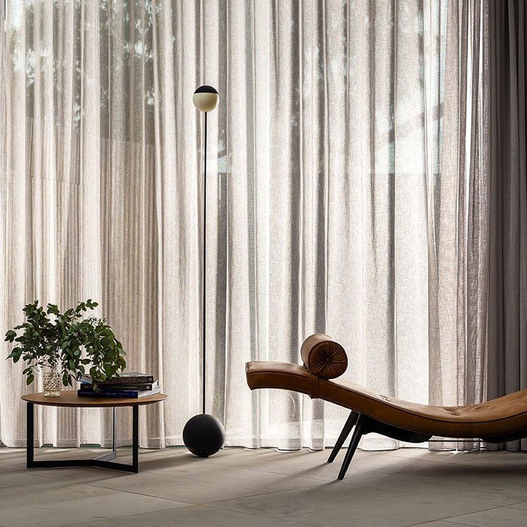 The Made By Pen SWAY Floor Lamp in a living room. The lamp was designed by an Australia industrial designer, Nick Rennie