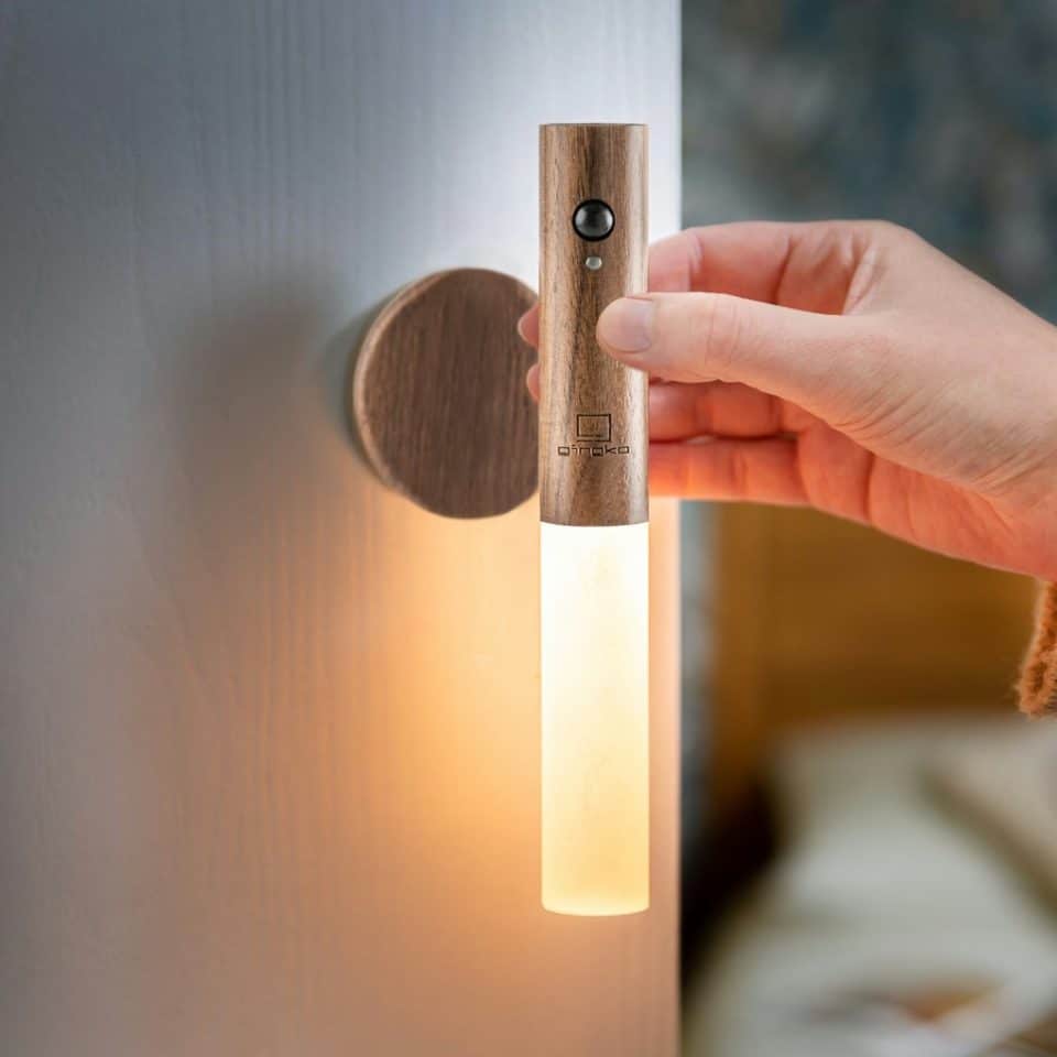 Designstuff Gingko Smart Baton Light Walnut mounted on a wall