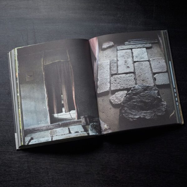 A excerpt from Axel Vervoordt's Wabi Inspirations Coffee Table Book featuring bricks and a doorpost.