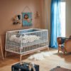 LEANDER Luna Cot, White in a nursery with a lion wall art