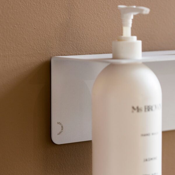 Close up of DESIGNSTUFF Shelf w/ Single Soap Dispenser Holder in White on a brown background