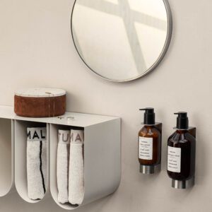 Dowel round mirror and wall soap holder with a curved shelf mounted on the wall