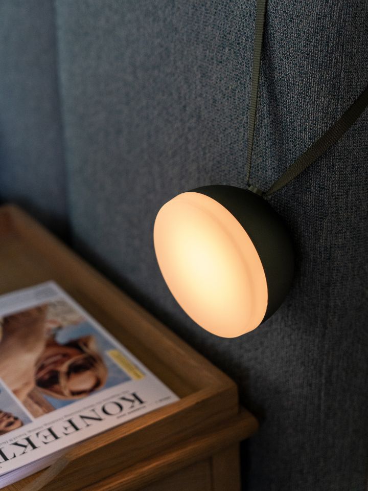 New Works Sphere lamp next to a bedside table