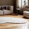 ferm Living Forma Wool Rug, Off-White in a Living Room with a Couch