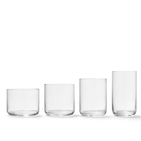 Four different sized glasses placed side-by-side next to each other.