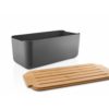Studio lighting, perspective view of a rectangular-shaped metal bread container with a bamboo lid placed next to it.