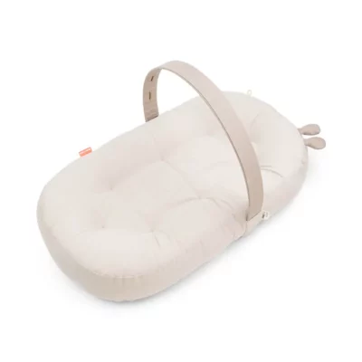 DONE BY DEER Cozy Baby Lounger with Activity Arch Raffi Sand in a white background