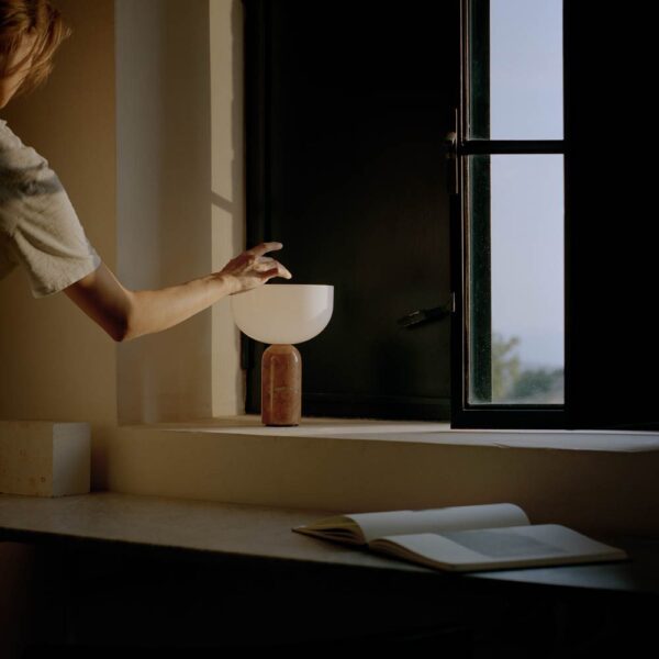 New Works Kizu portable lamp breccia pernice marble by the window