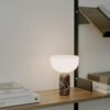 New Works Kizu portable lamp rosso levanto marble on a desk