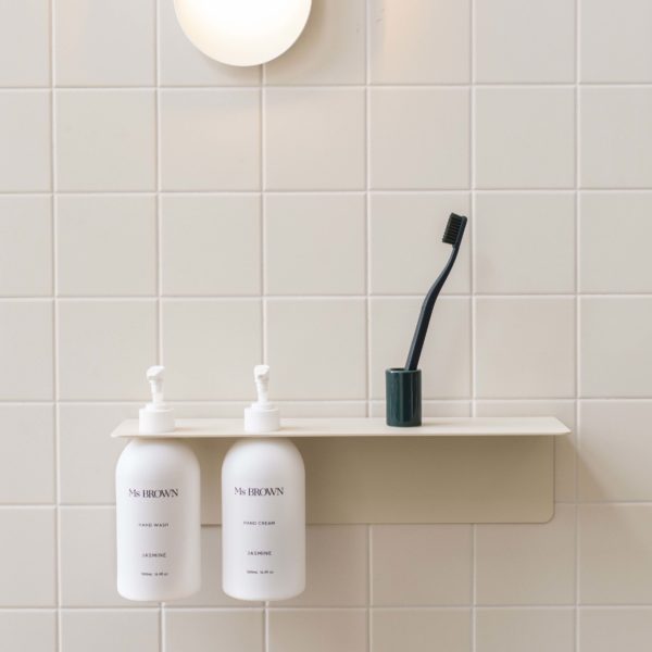 Sand DESIGNSTUFF Shelf w/ Dual Soap Dispenser Holder 40cm in a bathroom with white tile