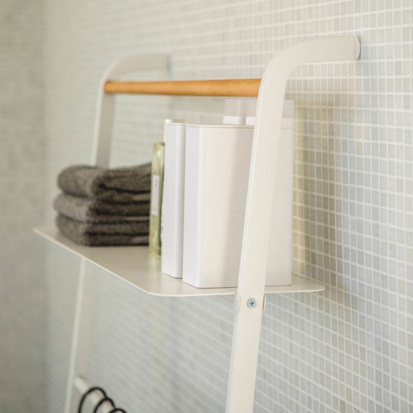 A towel ladder and bathroom shelf