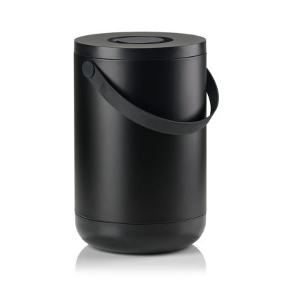 White background, perspective view studio image of a tall, black, cylindrical trash bin with a pail-type handle.