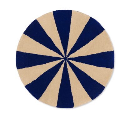 Studio lighting, white background, top view of a circle-shaped kids' rug with alternating blue and off-white slicing patterns.