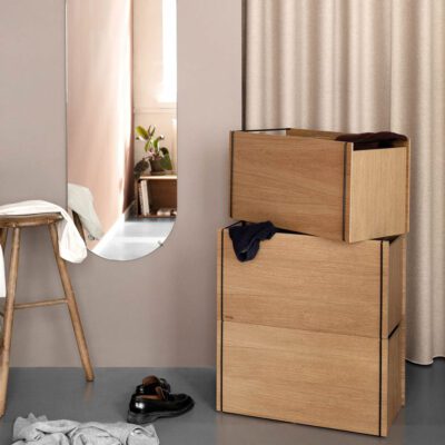 Three stacks of a storage box or bed side table and oval mirror