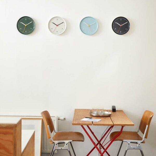 A group of wall clock in a dining room