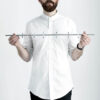 A man with beard wearing a white shirt is holding Moebe coat rack 6 pegs in chrome.
