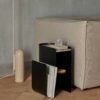 ferm LIVING Vault Side Table in black styled in seating area