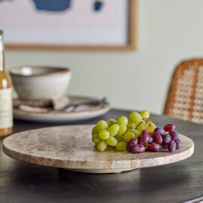 Red and white grapes on Bloomingville Nuni Turntable serving tray made from natural brown marble.