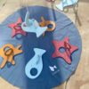 Wooden fishing game with starfish, fish and octopus with the fish pond and fish stick.