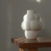 Louise Roe Ceramic Balloon Vase 04 Grande, Raw White on a table