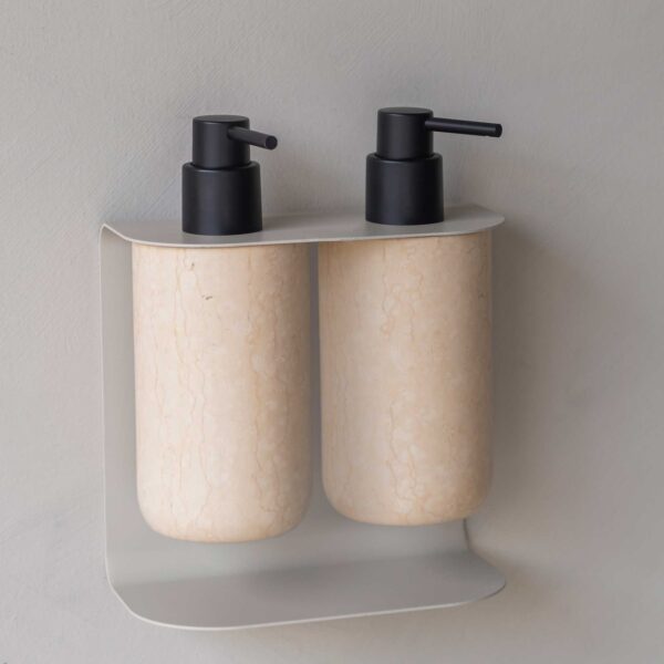 Soap dispensers made from marble on wall mounted soap dispenser holder from Mette Ditmer.