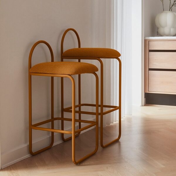 Studio lighting, perspective view of two stools placed next to a wall.