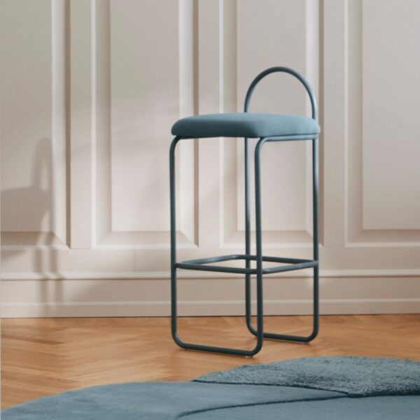 Studio lighting, perspective view of a stool in a living room next to a carpet