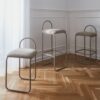 Natural lighting, perspective view of three stools placed in a living room corner