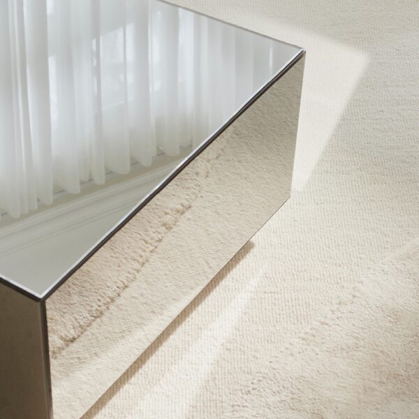 Natural lighting, close up perspective view of a mirror table's reflective details