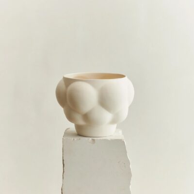 Studio lighting, close up shot of an odd-shaped ceramic bowl