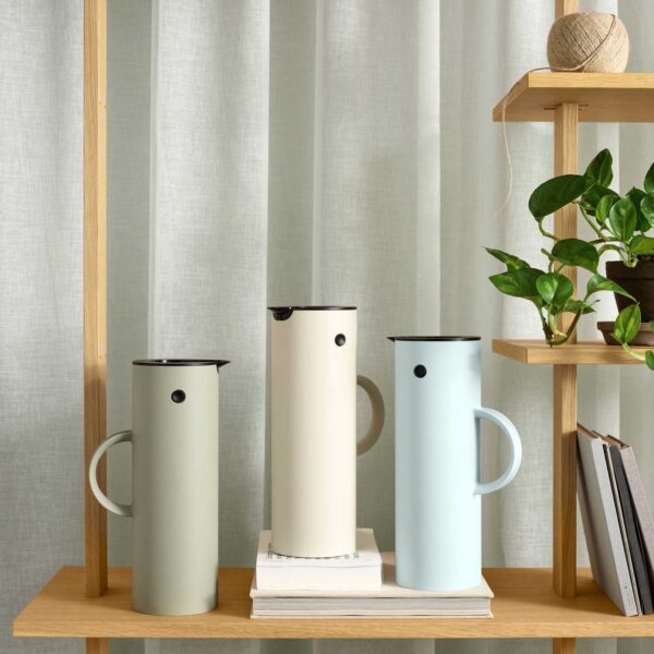 A group photo of classic vacuum jug from Stelton on a dining table.