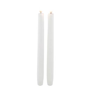 Two flameless, tapered candles standing next to each other.