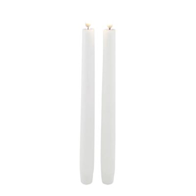 Two flameless, tapered candles standing next to each other.