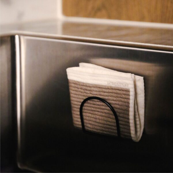 Folded Khaki Designstuff Dishcloth in a sink sponge holder