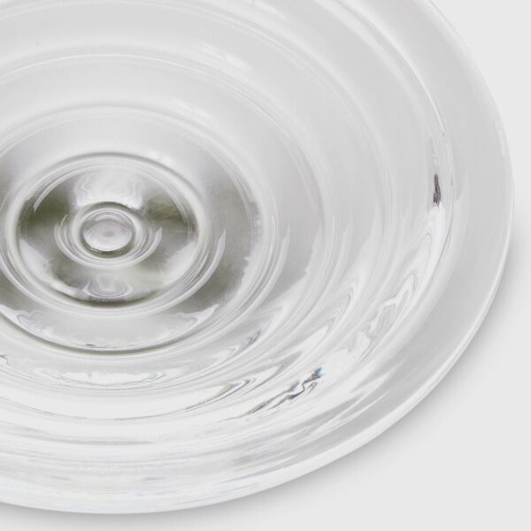 A detailed packshot of Press medium glass bowl by Tom Dixon.