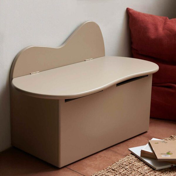 An organic shaped kids storage bench in cashmere made from certified MDF.
