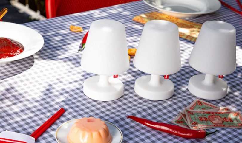 FATBOY's table lamps styled on a table with a gingham tablecloth.