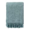 The Gotland wool blanket in turquoise with fringe
