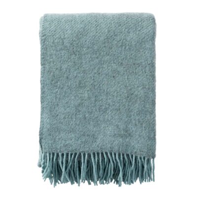 The Gotland wool blanket in turquoise with fringe