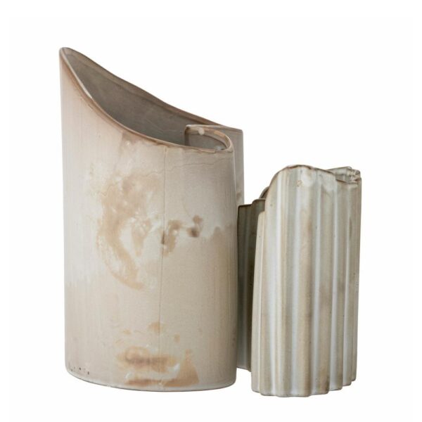 Studio lighting, side view of an abstract shaped vase.