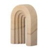 A side packshot of Laia deco in arch shaped made from natural sandstone.