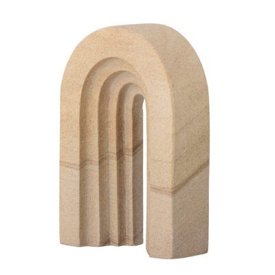 A side packshot of Laia deco in arch shaped made from natural sandstone.