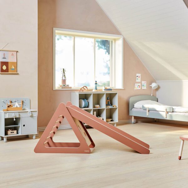 The beautiful Play Tower and Slide in blush from Flexa in kids room is perfect for a jungle gym, a slide and a hideout.