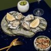 Oysters on Oasis serving tray made from natural jade marble.