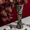 Versatile palm vase and a candle holder made from icy jade marble for modern homes.