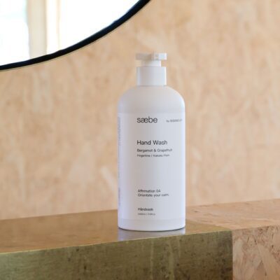 sæbe by DESIGNSTUFF Hand Wash Bergamot And Grapefruit 500ml sitting on a bench